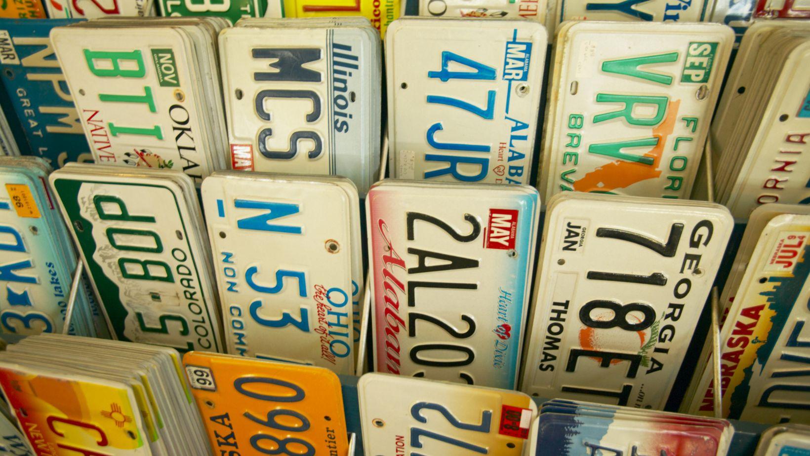 Rows of license plates from different states.