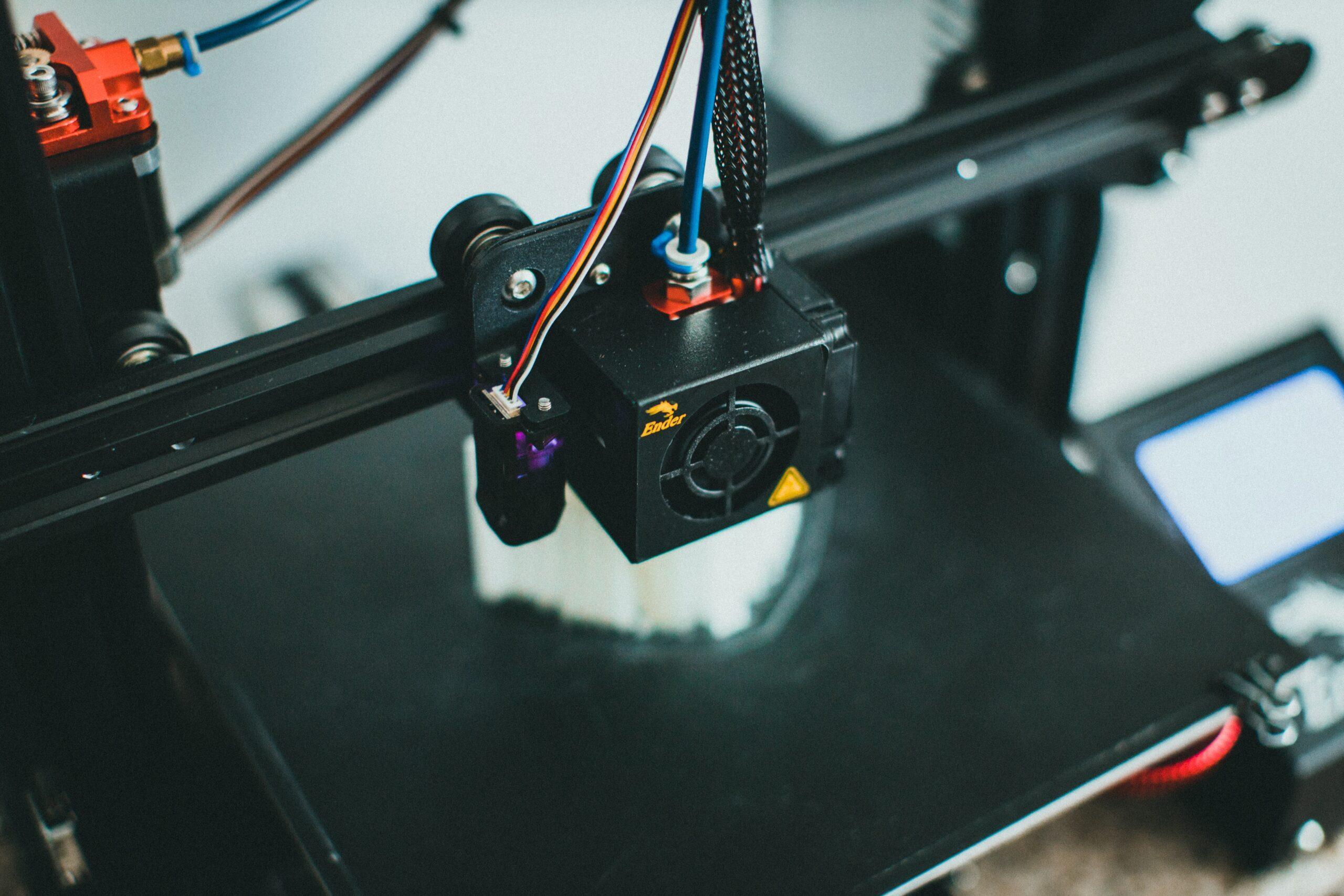 Photo of a 3D printer printing out an object